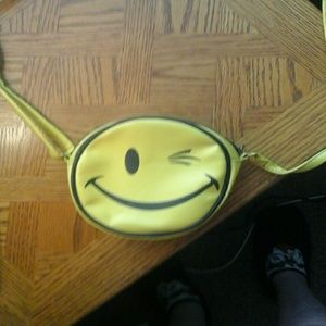Yellow winky face strap purse